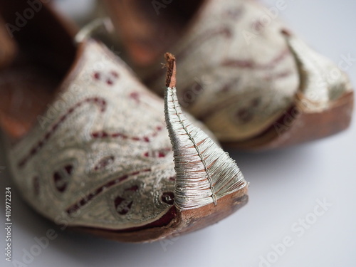 close up spiky handmade turkish leather shoes and delicate embroidery photo