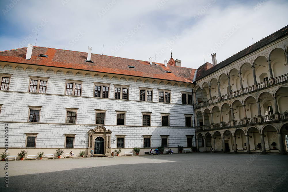 Courtyard of medieval castle and chateau, historical palace complex, arcades and white renaissance archs, National cultural landmark, Jindrichuv Hradec, South Bohemia, Czech Republic