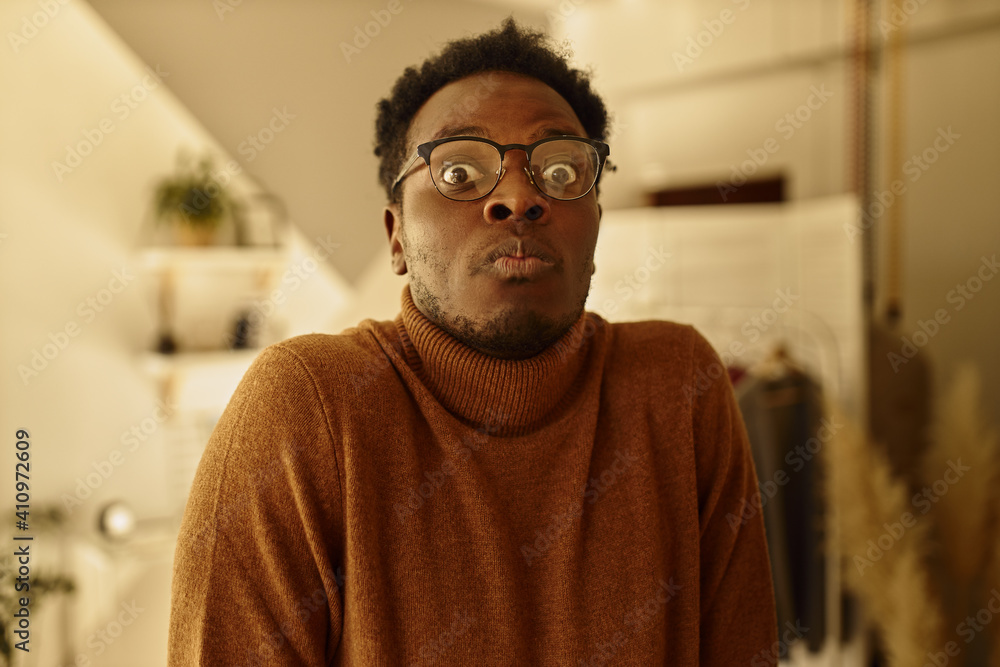 Oh my God. Emotional confused young dark skinned man in eyeglasses having forgetful look, realizing that he did something wrong, posing indoors, expressing puzzlement, confusion and uncertainty Oh my God. Emotional confused young dark skinned man in eyeglasses having forgetful look, realizing that he did something wrong, posing indoors, expressing puzzlement, confusion and uncertainty