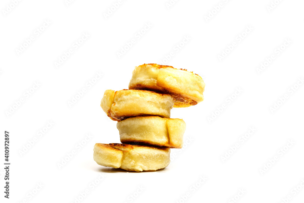 Fried potato rolls or alupatras stacked in pyramid one by one isolated on white Fried potato rolls or alupatras stacked in pyramid one by one isolated on white