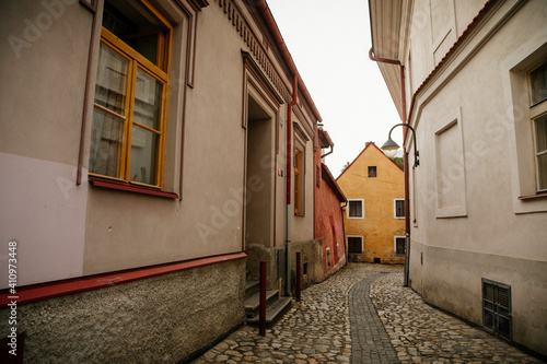 Narrow medieval picturesque street with baroque and renaissance historical buildings in sunny summer day  beautiful cityscape of medieval town  Tabor  South Bohemia  Czech Republic