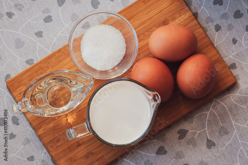 Ingredients for homemade pancakes. Cooking for someone special concept. Top view, selective focus