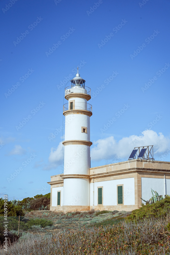 White lighthouse with blue sky