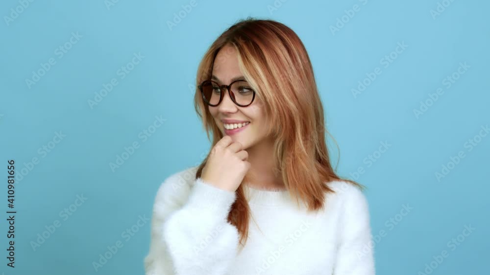 Teenager girl with glasses standing and looking to the side over isolated background Teenager girl with glasses standing and looking to the side over isolated background