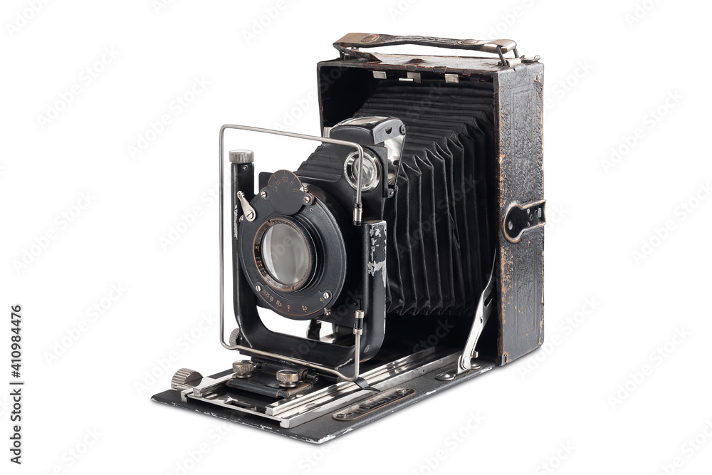 Old camera isolated on white background. Vintage photo camera in an open state.