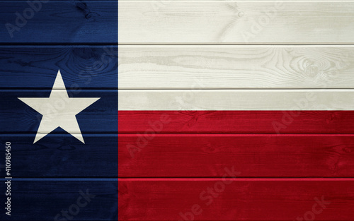 Texas State Flag on an old wooden surface.