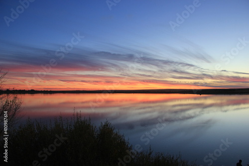 sunset over the river © Yuliya