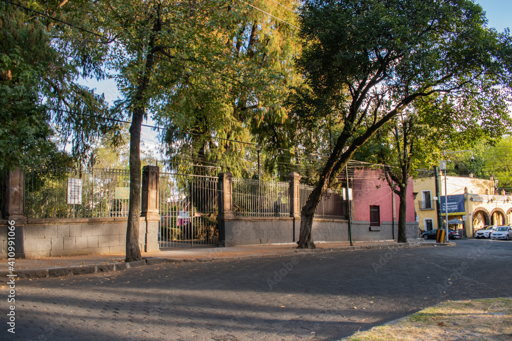 Park entrance in Mexico City surrounded by trees