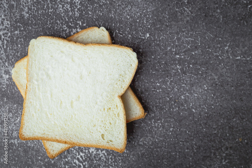 Sliced bread on dark grunge...