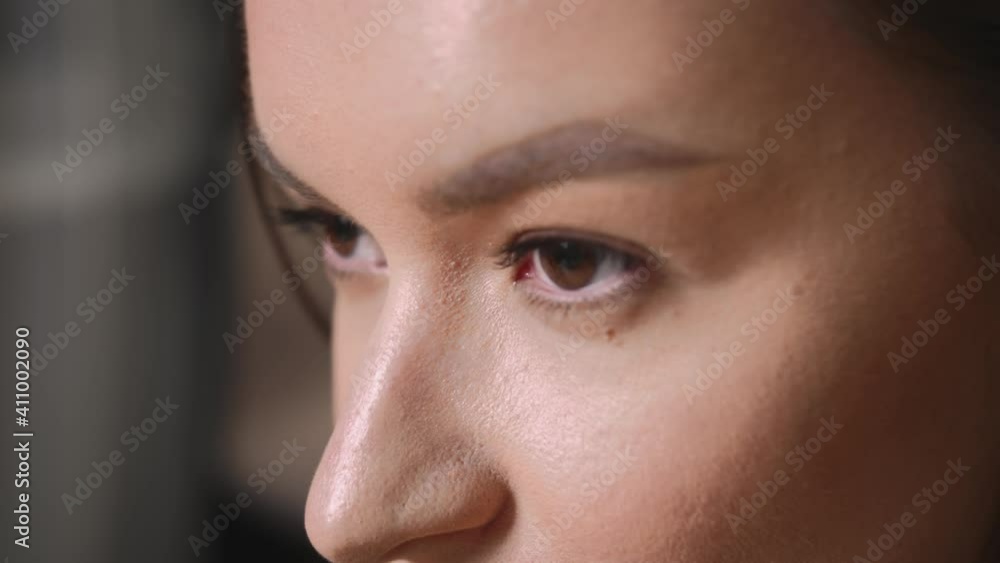 Closeup of Woman Face, woman has beautiful brown Eyes. Natural Beauty. Gorgeous woman with long Eyelashes and Attractive Appearance. Slow motion. Closeup of Woman Face, woman has beautiful brown Eyes. Natural Beauty. Gorgeous woman with long Eyelashes and Attractive Appearance. Slow motion.
