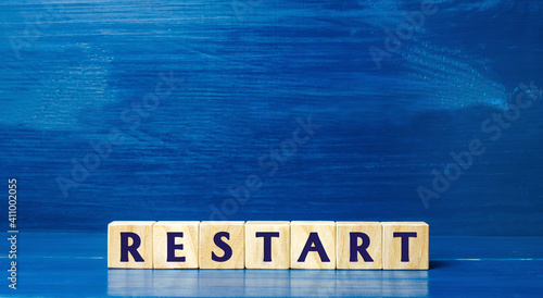 Wooden blocks with the word Restart. New beginning and launch. Start of a new process. Back to the roots. Business concept. Start again. Renewal