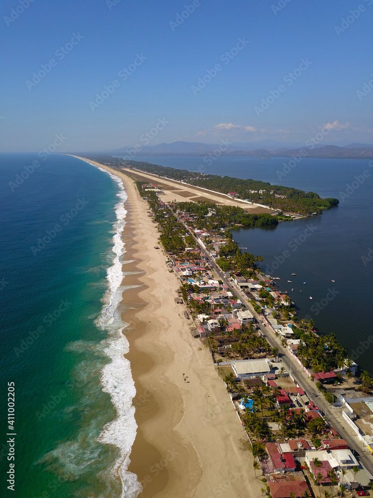 Vertical Aerial View of the sea, the Coyuca lagoon and the air base track