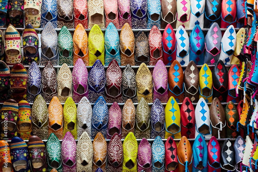 A stall in bazaar market with multi-colored leather slippers, filling the frame, Fez, Morocco