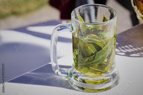 Traditional Peruvian tea infusion from coca leaves in a mug, Peru
