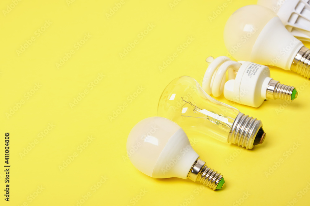 several different bulbs on a yellow background, copy space, trend color several different bulbs on a yellow background, copy space, trend color