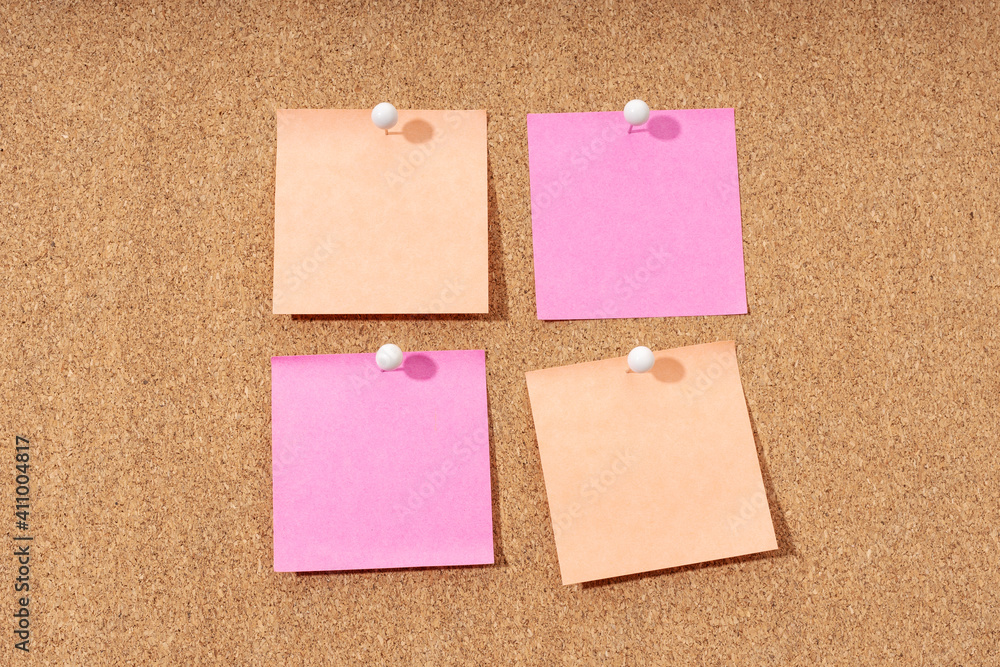 Group of four Blank note on a cork board for adding text and push pin. Mock up Group of four Blank note on a cork board for adding text and push pin. Mock up