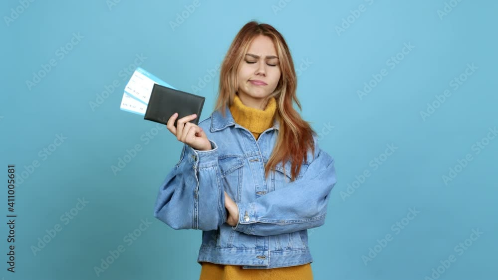 Teenager girl holding a passport having doubts and questioning an idea over isolated background Teenager girl holding a passport having doubts and questioning an idea over isolated background