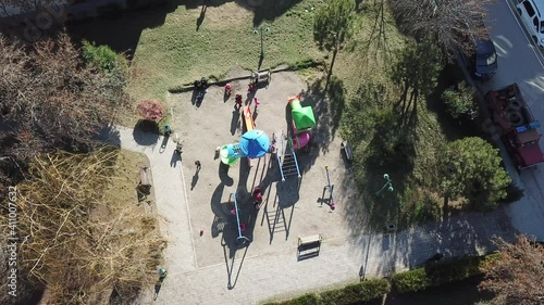 aerial view of children playground. kids are playing game at the sunset.