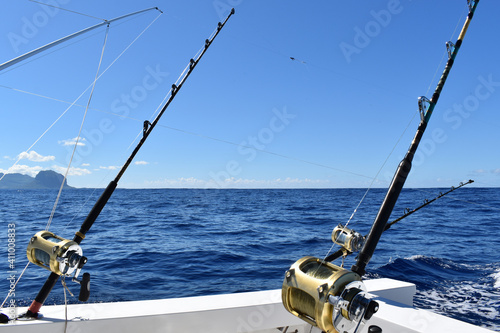 Fishing rods set on a boat for a big game fishing trip. Leisure, sport activity, vacations background.
