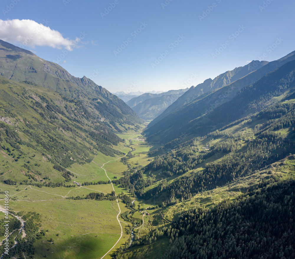 Aerial drone shot of Grossglockner mountain range valley in summer in Austria Aerial drone shot of Grossglockner mountain range valley in summer in Austria