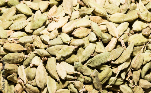 dry green cardamon close uo background texture