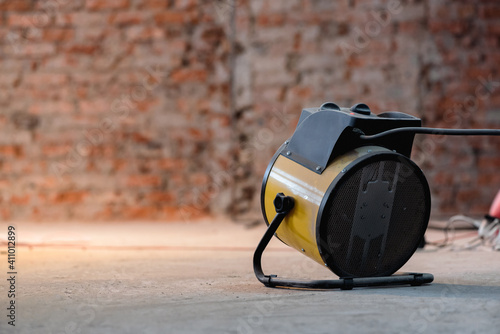 Fotografie Electric air heater on the floor close up background.