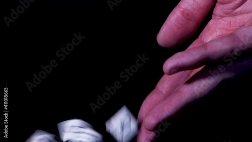 hand full of poker dice ready to be rolled