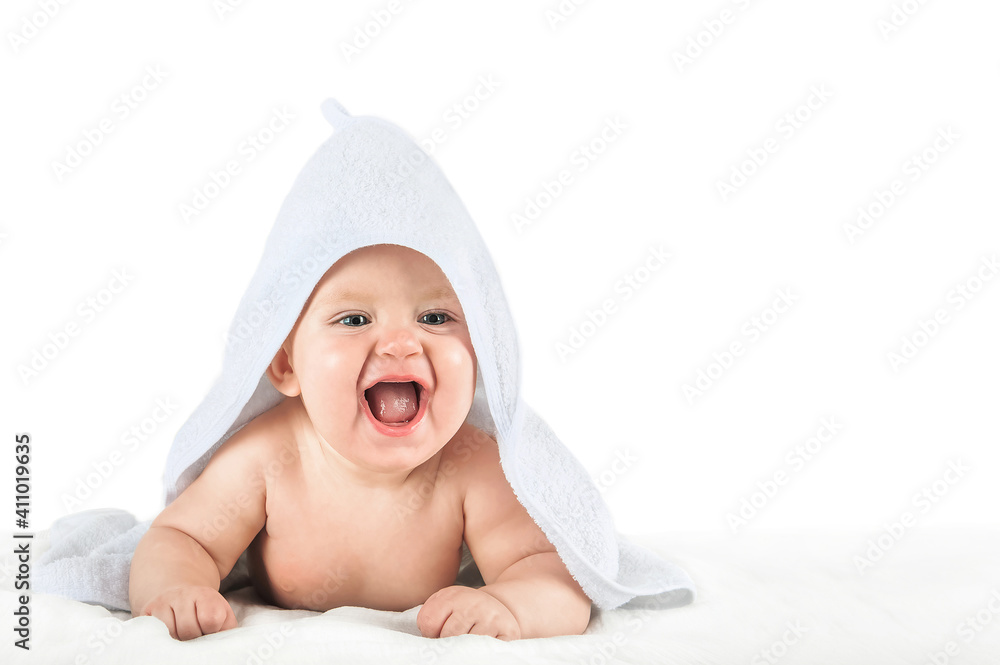 Close-up child in white towel isolated on white background. Bathing babies and restful sleep. funny toddler. 