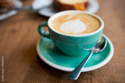 Closeup image of a cup of milk coffee