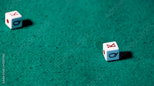 poker dice falling on green felt