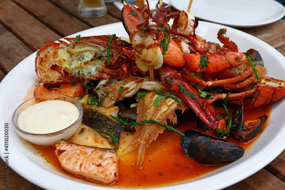 Grilled seafood platter on wooden table Grilled seafood platter on wooden table