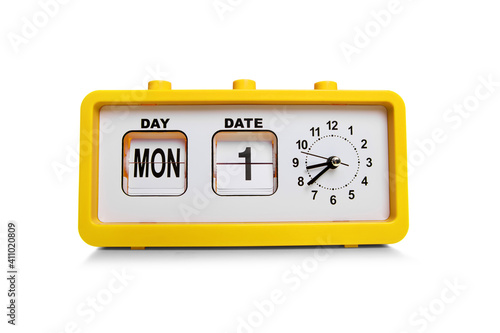 Retro electronic alarm clock and analog flip calendar. Retro design from 60s 70s home interior. Bright yellow color.