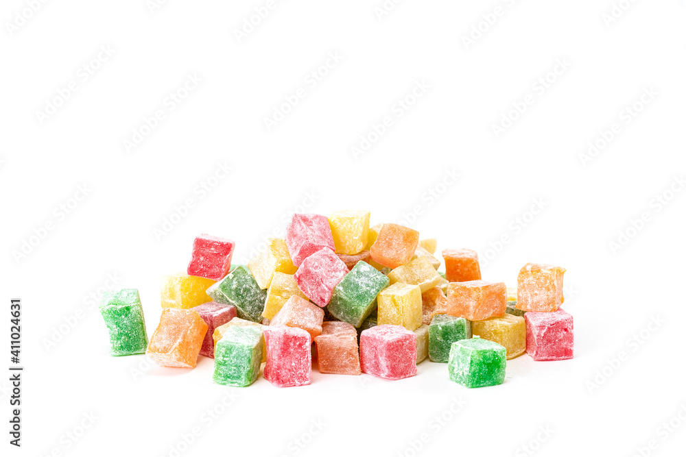 A large number of colorful cubes of rahat lukum on a white background A large number of colorful cubes of rahat lukum on a white background