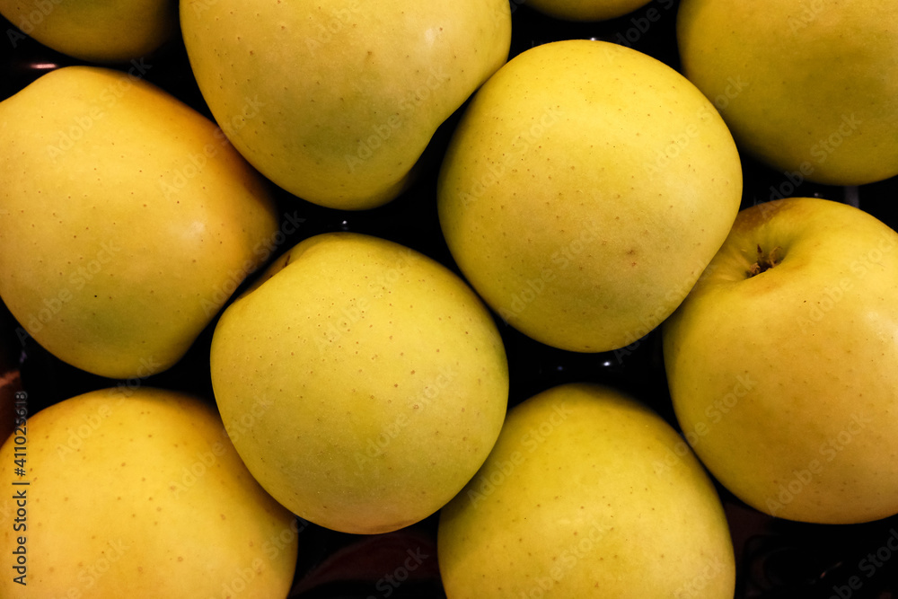 background with horizontal yellow apples background with horizontal yellow apples