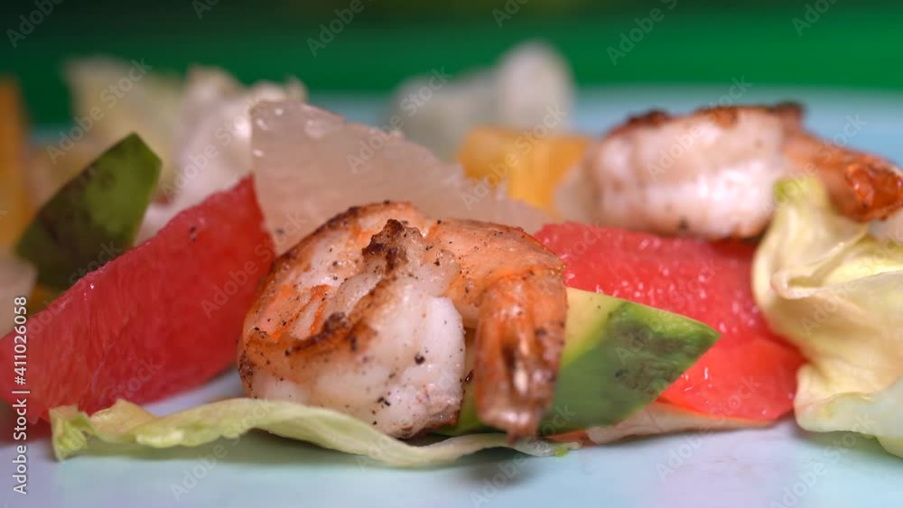 Salad with grilled shrimp, avocado, vegetables and other greens Salad with grilled shrimp, avocado, vegetables and other greens