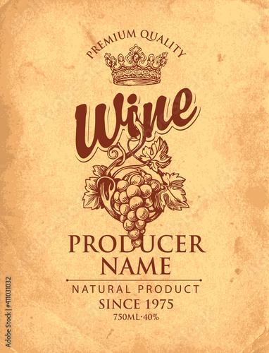 Vector wine label with hand-drawn bunch of grapes, ornate crown and inscriptions on an old paper background in retro style