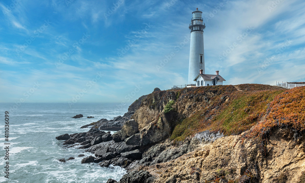 Pigeon Point lighthouse against the backdrop of a beautiful sky and ocean with waves, a great landscape of the Pacific coast in California