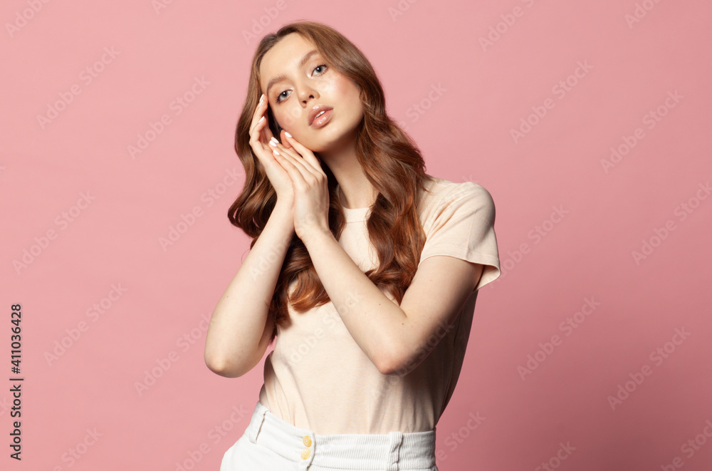young casual style woman posing isolated on pink background young casual style woman posing isolated on pink background