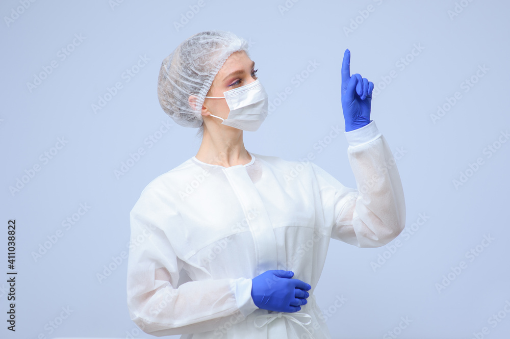 Portrait of a female doctor or nurse wearing medical cap and face mask Portrait of a female doctor or nurse wearing medical cap and face mask