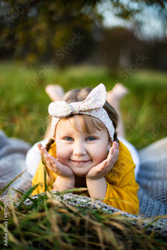Little girl and beautiful autumn evening