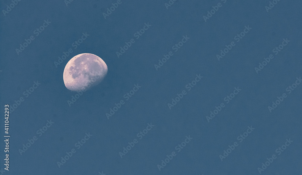 Moon in blue sky