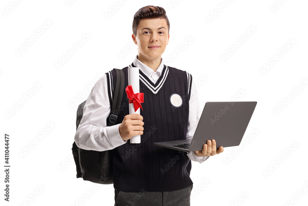 Schoolboy holding a laptop and a diploma Schoolboy holding a laptop and a diploma