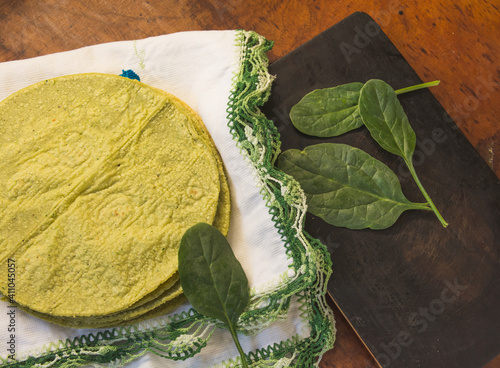 Green corn tortillas, with ingredients that paint them, such as nopal, spinach. 