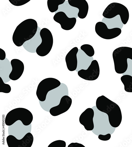 Vector seamless pattern of hand drawn leopard dotted fur print isolated on white background