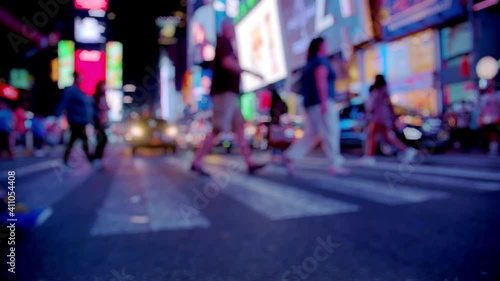 New York City Times Square street by night, crowd of tourists, anonymous people walk, slow motion