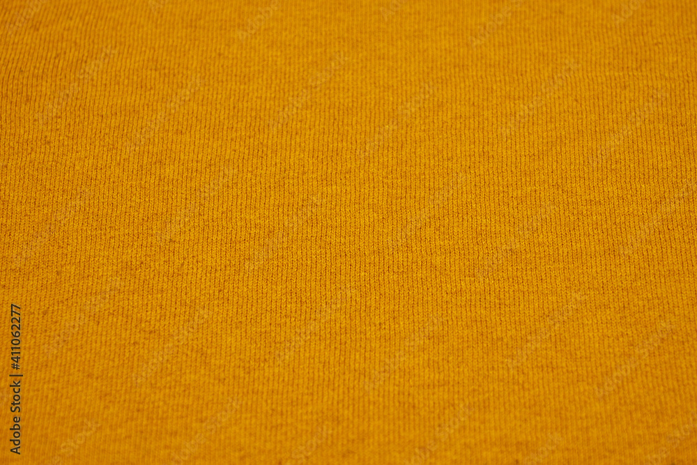 Texture of a yellow cotton canvas as a background. Texture of a yellow cotton canvas as a background.