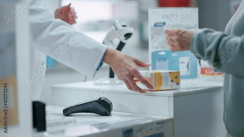 Wallpaper Mural Pharmacy Drugstore Checkout Cashier Counter: Pharmacist and a Customer Using Contactless Credit Card with Payment Terminal to Buy Prescription Medicine, Health Care Goods. Close-up Focus on Hands Torontodigital.ca