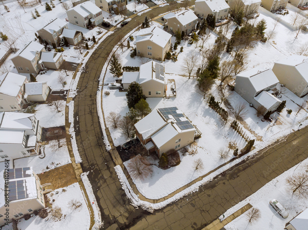 Aerial down view to on covered houses and roads at winter season courtyards covered snow with snow