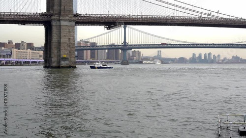 Police Boat under Brooklyn Bridge, NYPD Boat on East River in New York City