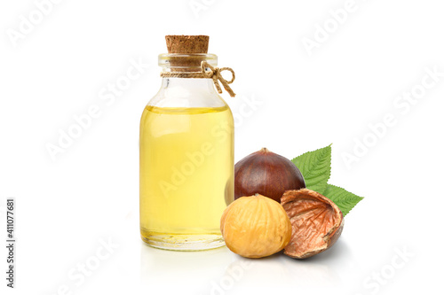 Canvas Print Chestnut oil with seed and leaves isolated on white background.